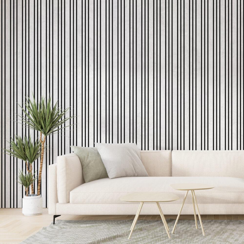 Canapé beige, coussins verts, décor moderne.