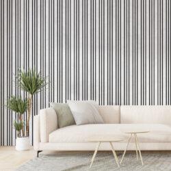 Canapé beige, coussins verts, décor moderne.
