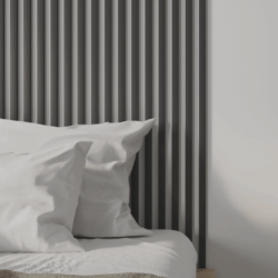 Oreillers blancs, tête de lit gris MDF.